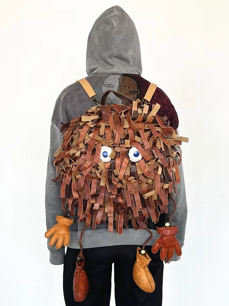 New Cartoon Style Personalized Creative Coal Ball Tassel Backpack Personalized High-quality Top Layer Cowhide Backpack For Women